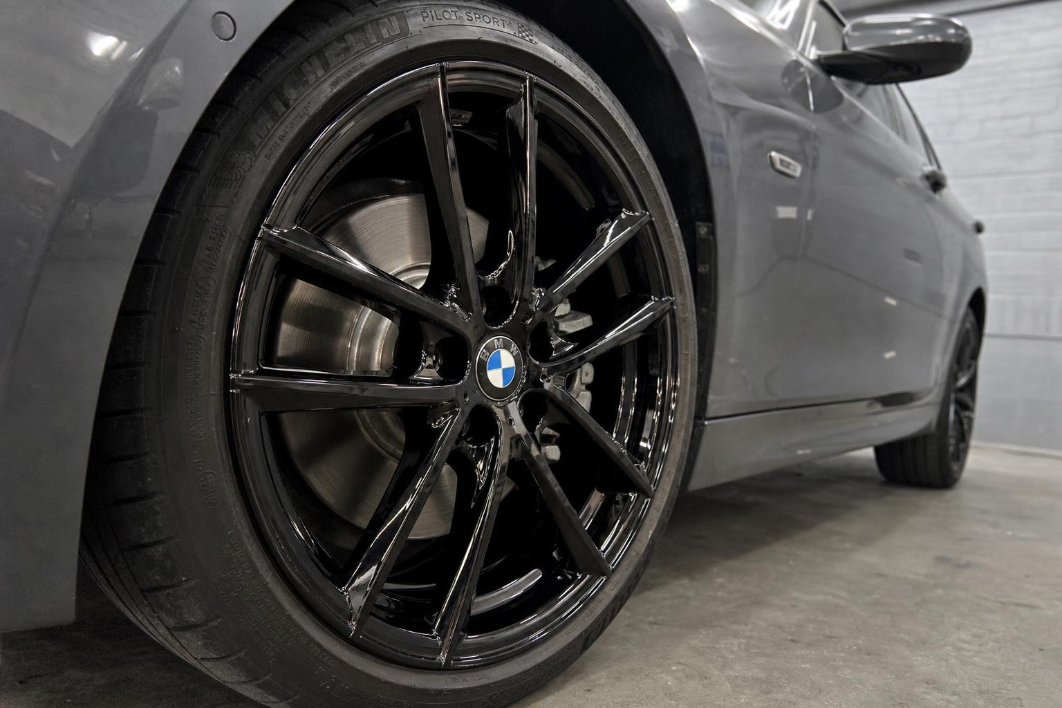 BMW 3 Series — gloss black wheels