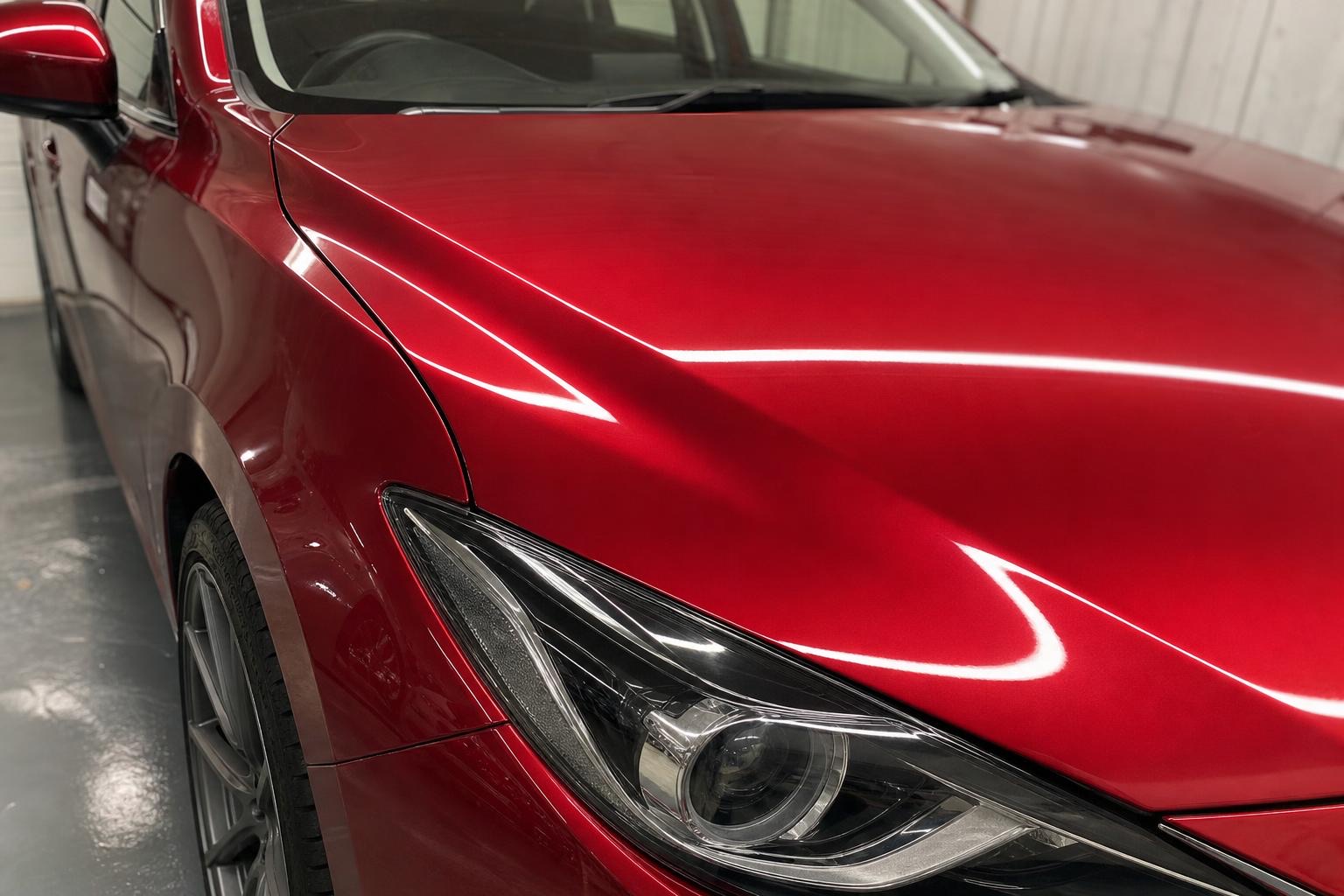 Mazda 3 — bonnet and wing