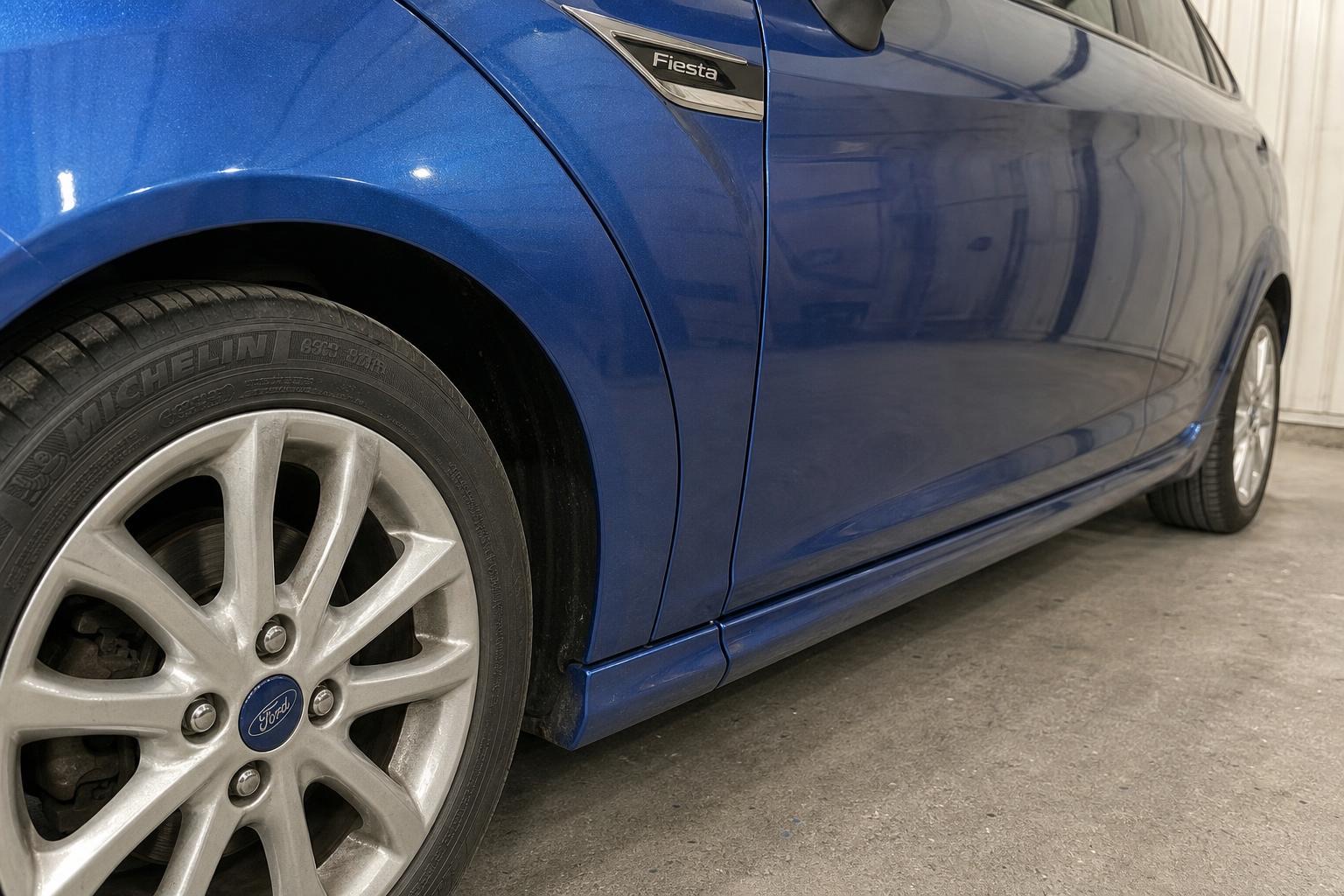 Ford Fiesta — scuffed sill and wing